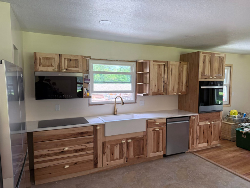Custom hickory kitchen cabinets and farmhouse sink